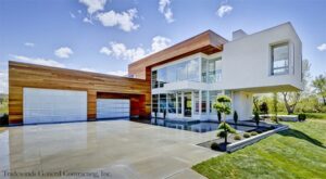 Luxury House with Two White Glass Garage Doors