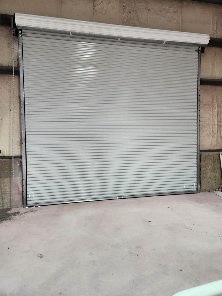 Image of Modern White Commercial Sheet Garage Doors by Rose Quality Garage Doors Serving Murfreesboro, Nashville, Knoxville, Clarksville, and Franklin, TN locations.